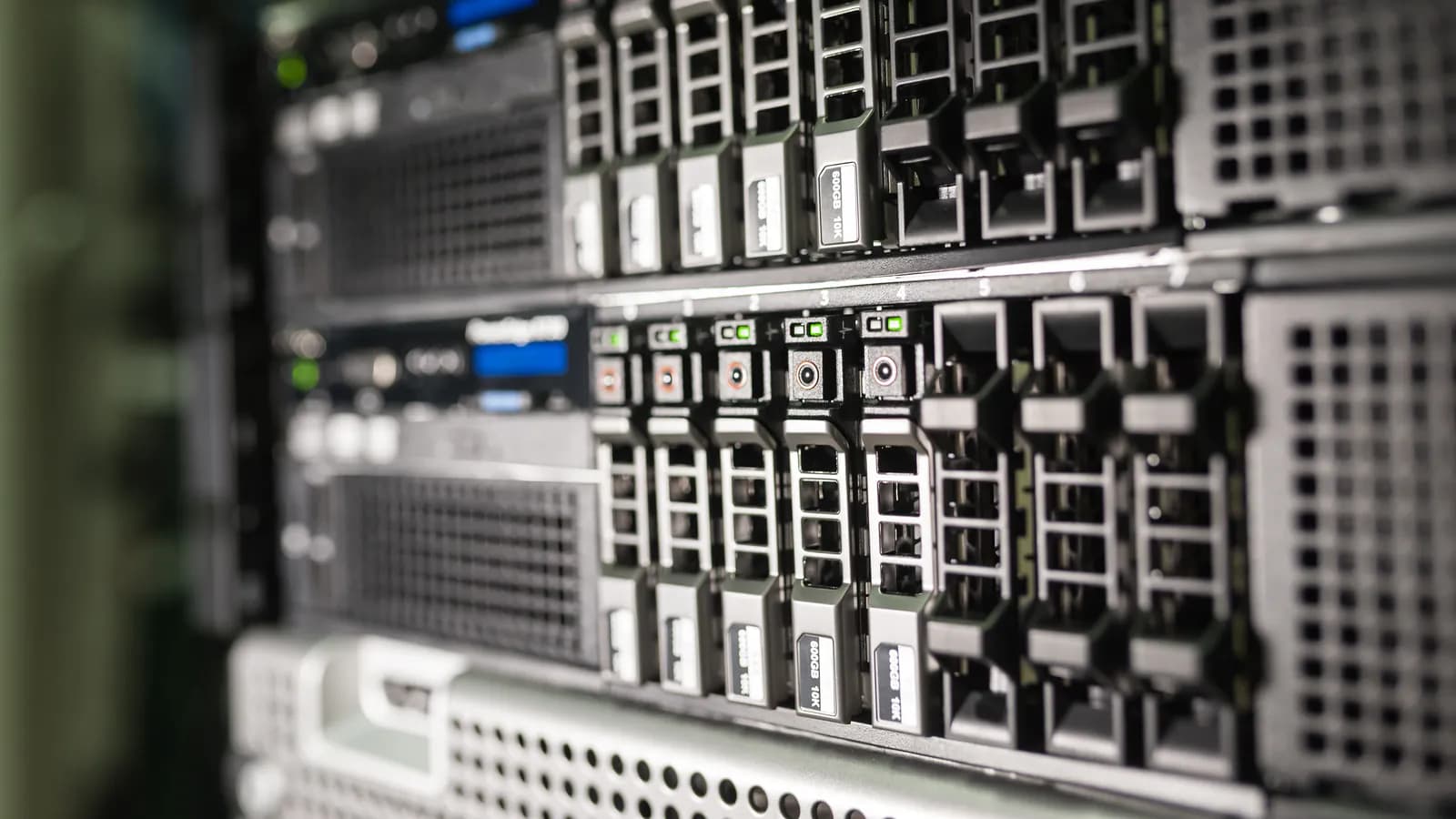 A dark server room with rows of data racks lit by blue cable lighting running between them — a visual for a large volume of stored data.